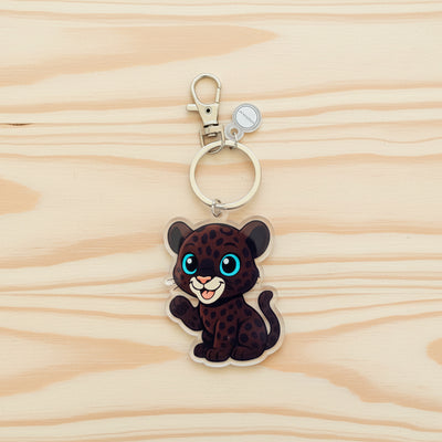 Keychain with a black leopard design on a black background