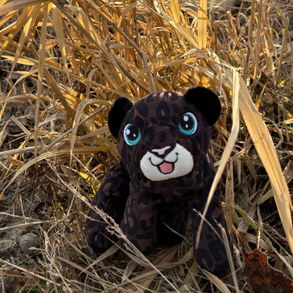 black leopard in tall grass