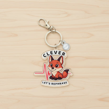 Keychain with a fox design and text on a wood background