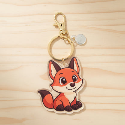 Keychain with a the fox supportive little buddy design on a wood background